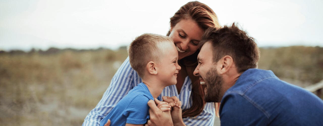 photo-of-parents-and-small-kid-smiling-to-each-other
